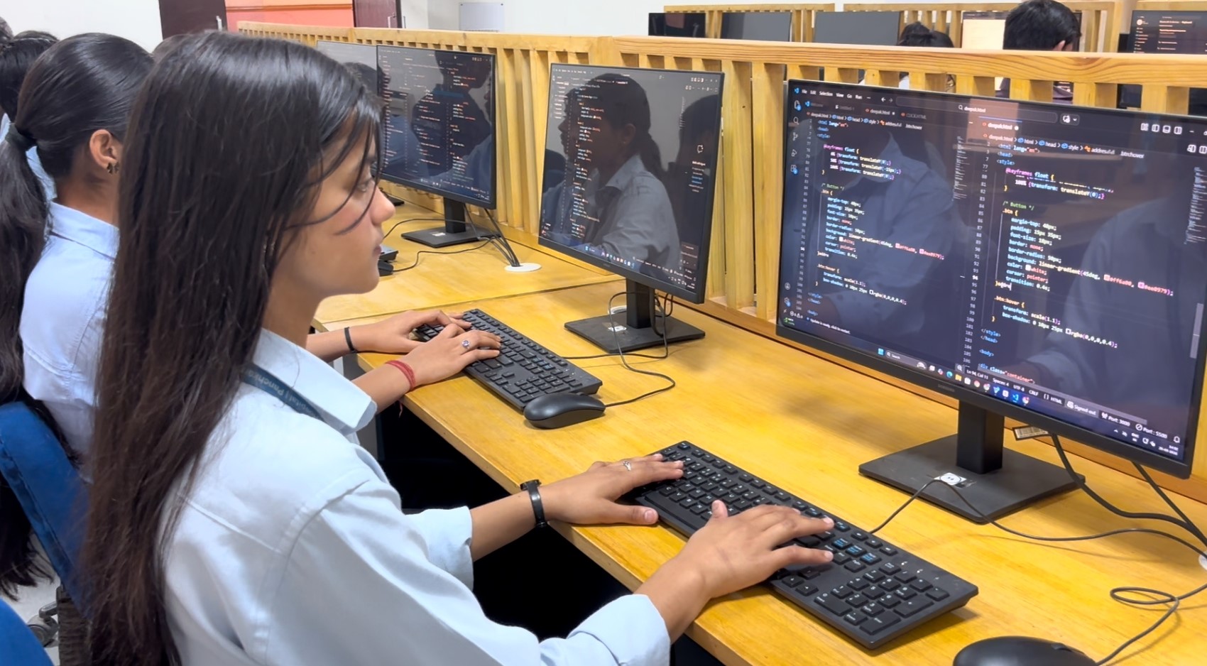 Student coding in IT Lab